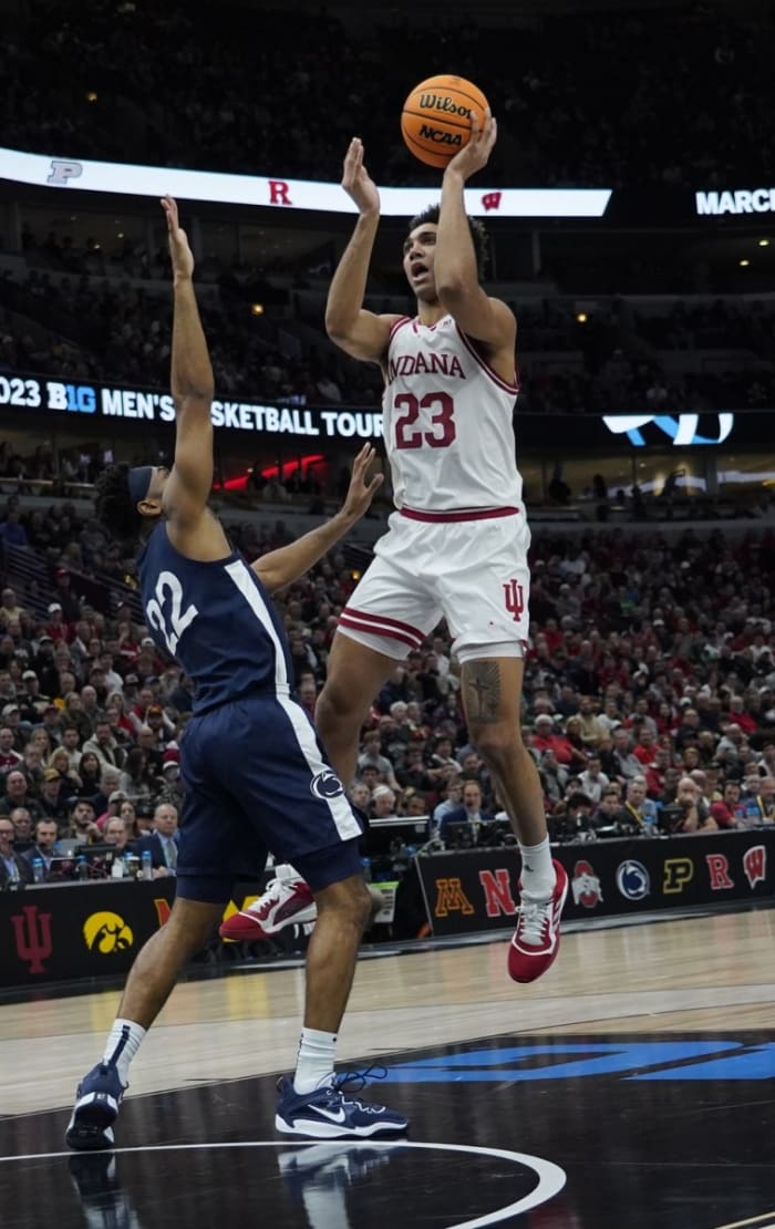 Trayce Jackson-Davis (23) is defended by Penn State Nittany Lions guard Jalen Pickett (22) during the first half at United Center.